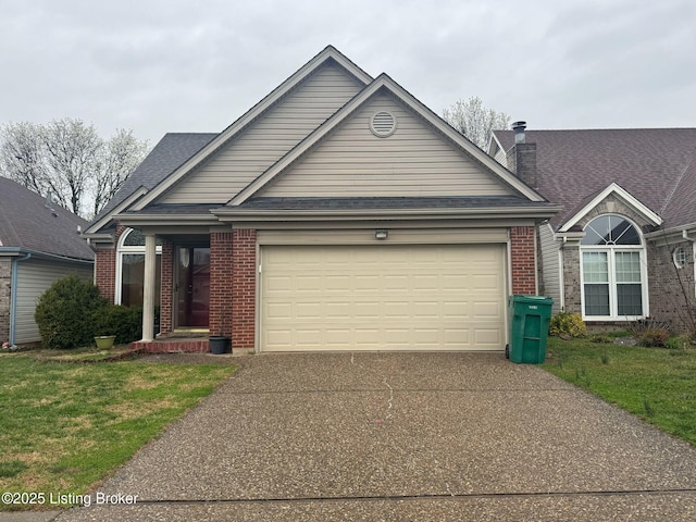 3324 Rainview Cir, Louisville, KY 40220 - view of front facade with a front lawn, driveway, an attached garage, and brick siding