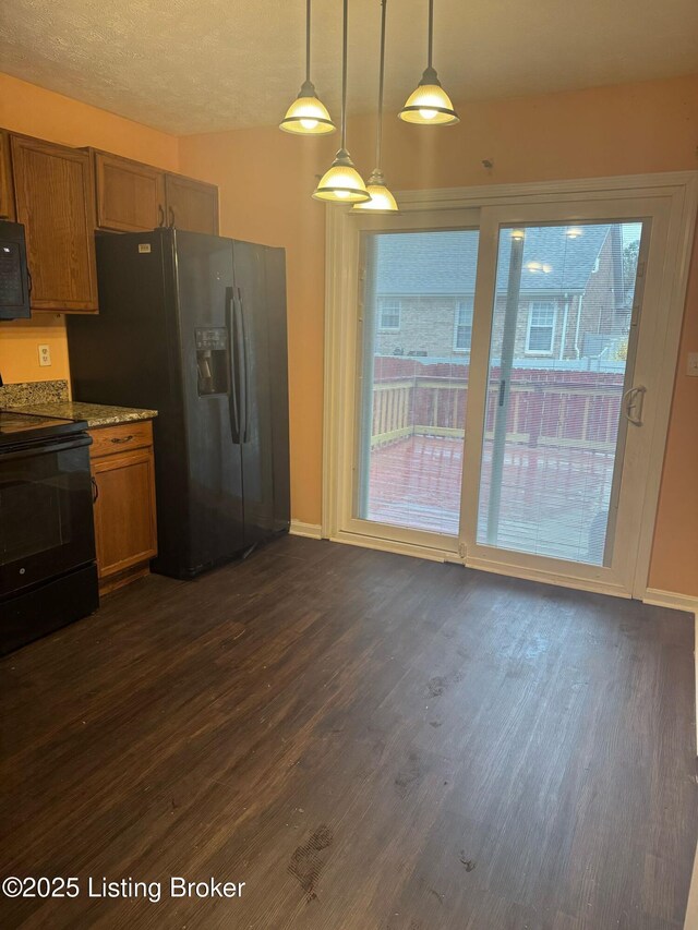 3324 Rainview Cir, Louisville, KY 40220 - kitchen with dark wood-style flooring, baseboards, decorative light fixtures, black appliances, and brown cabinetry