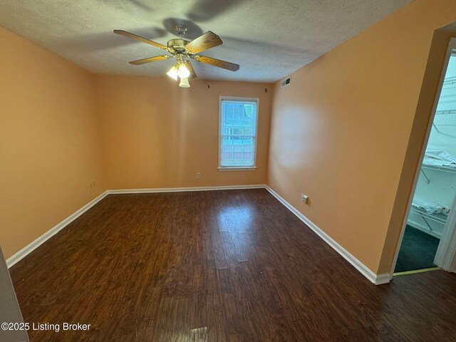 3324 Rainview Cir, Louisville, KY 40220 - spare room with baseboards, a textured ceiling, ceiling fan, and wood finished floors
