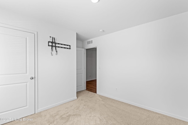 243 Zelcova Dr, Eminence, KY 40019 - unfurnished bedroom with baseboards, visible vents, and carpet floors
