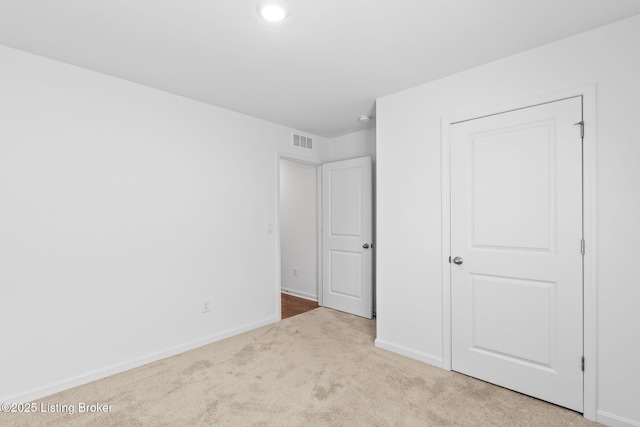 243 Zelcova Dr, Eminence, KY 40019 - unfurnished bedroom featuring carpet floors, baseboards, and visible vents