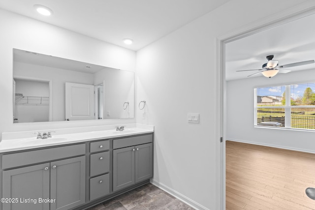 243 Zelcova Dr, Eminence, KY 40019 - bathroom featuring double vanity, a sink, and baseboards