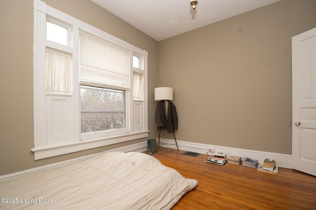 bedroom with wood finished floors