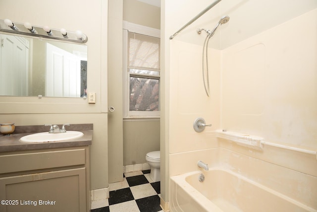 full bathroom featuring tile patterned floors, toilet, vanity, shower / tub combination, and baseboards