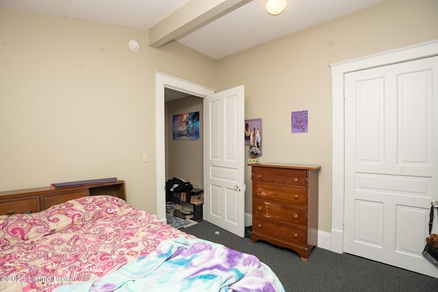 bedroom featuring vaulted ceiling with beams and carpet