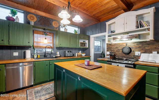 kitchen featuring a sink, butcher block countertops, tasteful backsplash, and stainless steel appliances