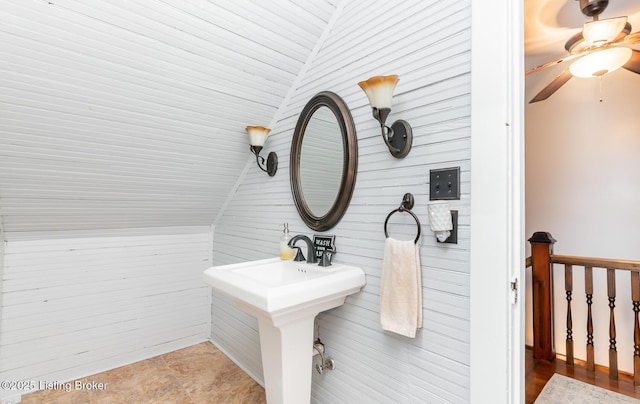 bathroom with ceiling fan and lofted ceiling