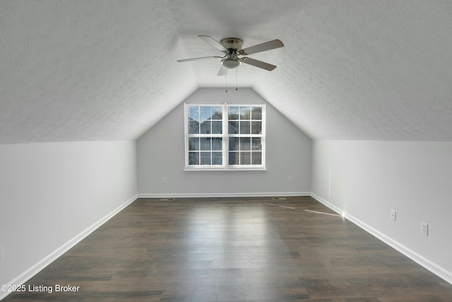 bonus room featuring a textured ceiling, wood finished floors, and a ceiling fan