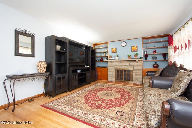 3019 Leman Dr, Louisville, KY 40220 - living room featuring a fireplace, baseboards, and wood finished floors