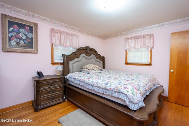 3019 Leman Dr, Louisville, KY 40220 - bedroom featuring light wood finished floors and multiple windows
