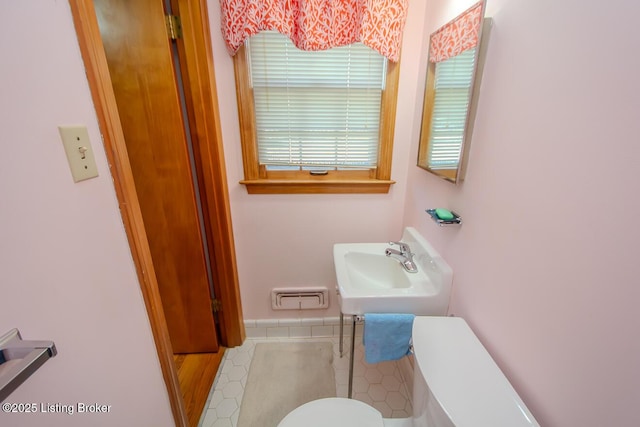 3019 Leman Dr, Louisville, KY 40220 - bathroom featuring toilet, tile patterned floors, and a sink