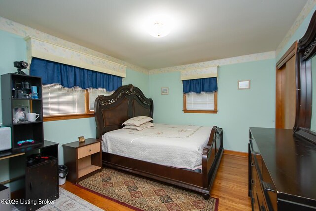 3019 Leman Dr, Louisville, KY 40220 - bedroom featuring baseboards, wallpapered walls, and wood finished floors