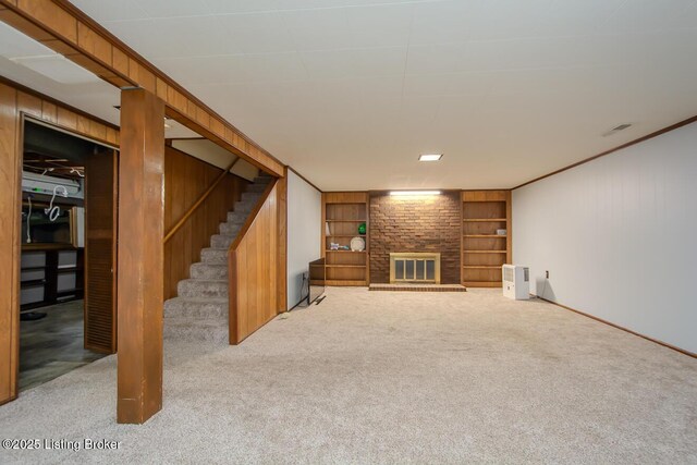 3019 Leman Dr, Louisville, KY 40220 - unfurnished living room featuring built in features, baseboards, carpet, a fireplace, and stairway
