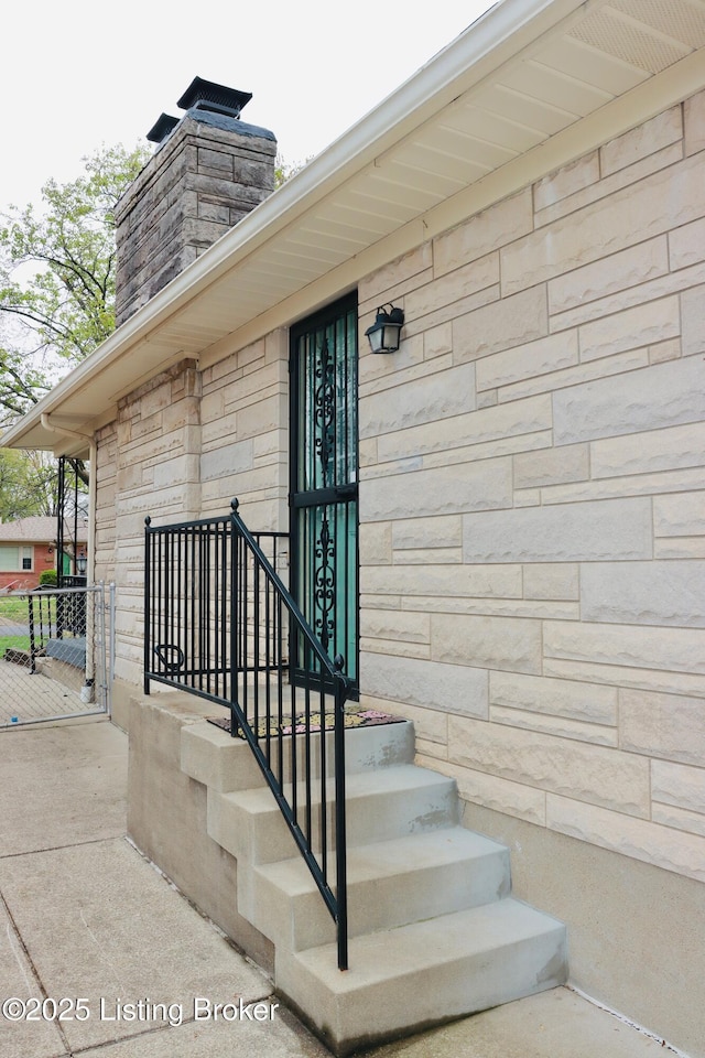 3019 Leman Dr, Louisville, KY 40220 - property entrance featuring stone siding and a chimney