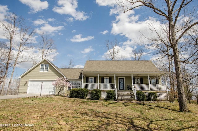 view of front of property with a front lawn, driveway, a shingled roof, and covered porch