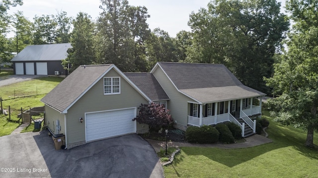160 Oakland Hills Cir, Leitchfield, KY 42754 - view of front facade with a porch, a garage, and a front yard