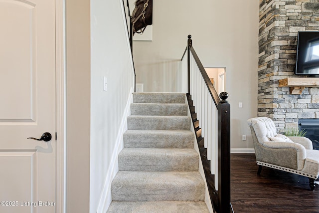18104 Bridle Run Dr, Louisville, KY 40245 - stairway with a stone fireplace, baseboards, and wood finished floors