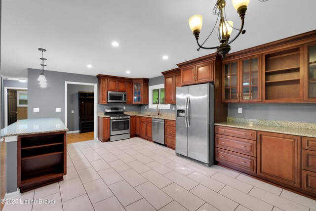 1468 Lakeshore Pkwy, Brandenburg, KY 40108 - kitchen featuring appliances with stainless steel finishes, open shelves, brown cabinets, recessed lighting, and light stone counters