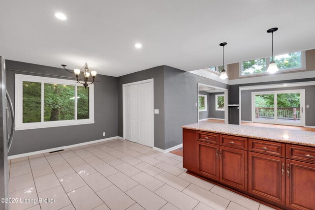 1468 Lakeshore Pkwy, Brandenburg, KY 40108 - kitchen with a chandelier, hanging light fixtures, light stone countertops, recessed lighting, and light tile patterned flooring