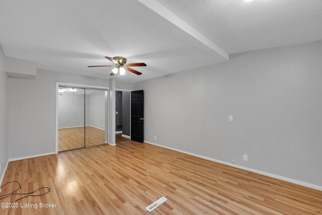 1468 Lakeshore Pkwy, Brandenburg, KY 40108 - unfurnished bedroom featuring light wood-style flooring, a ceiling fan, and a closet