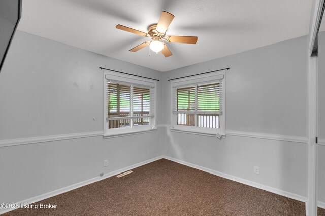 1468 Lakeshore Pkwy, Brandenburg, KY 40108 - spare room featuring dark colored carpet and ceiling fan