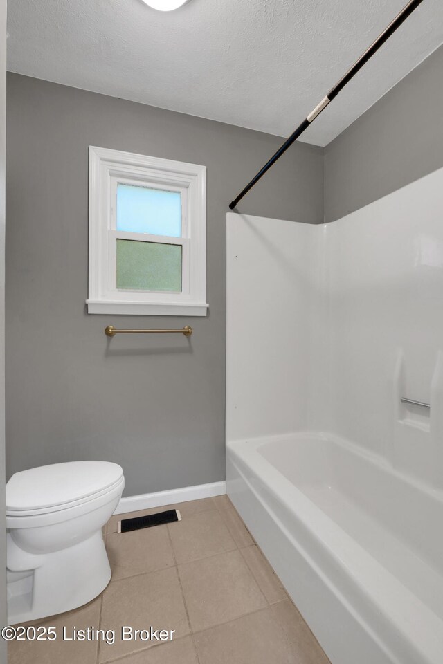 1468 Lakeshore Pkwy, Brandenburg, KY 40108 - bathroom featuring tile patterned flooring, bathtub / shower combination, and a textured ceiling