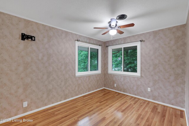 1468 Lakeshore Pkwy, Brandenburg, KY 40108 - unfurnished room featuring wood finished floors, a ceiling fan, and crown molding