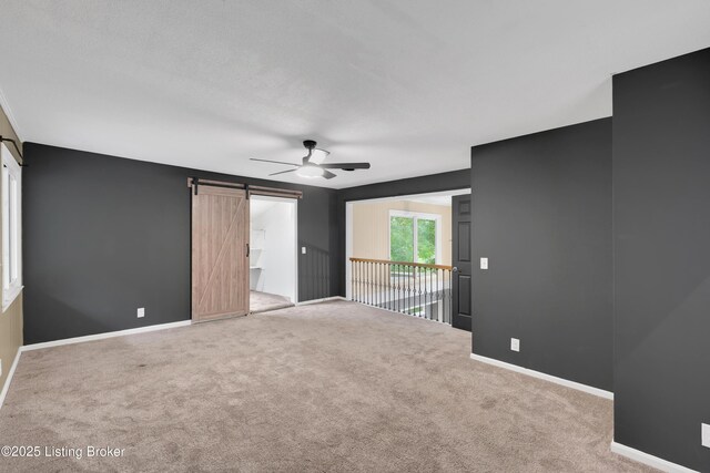 1468 Lakeshore Pkwy, Brandenburg, KY 40108 - carpeted spare room with ceiling fan and a barn door