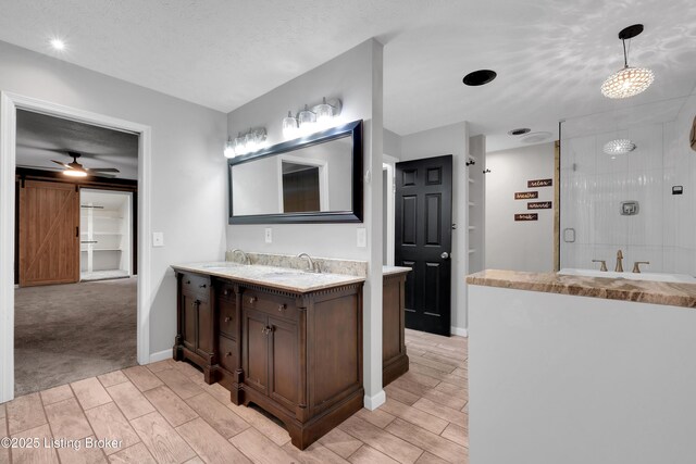 1468 Lakeshore Pkwy, Brandenburg, KY 40108 - full bath featuring wood finish floors, double vanity, a stall shower, and ceiling fan