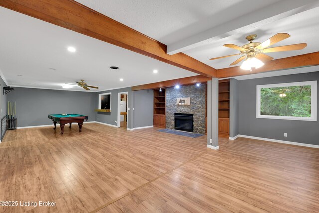 1468 Lakeshore Pkwy, Brandenburg, KY 40108 - unfurnished living room with a ceiling fan, beam ceiling, pool table, light wood-style floors, and a fireplace