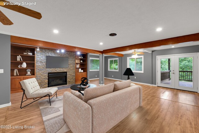 1468 Lakeshore Pkwy, Brandenburg, KY 40108 - living room featuring ceiling fan, light wood finished floors, a stone fireplace, recessed lighting, and built in shelves
