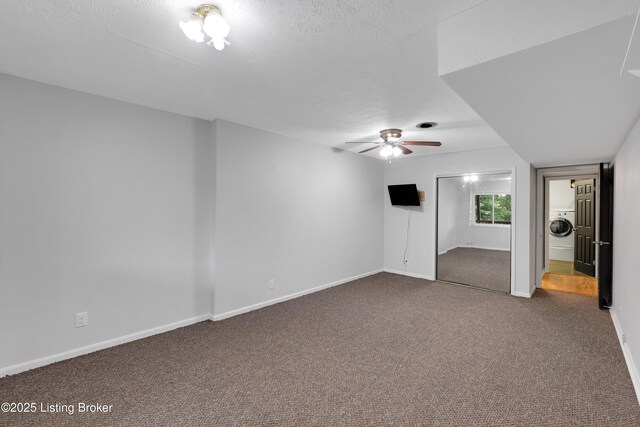 1468 Lakeshore Pkwy, Brandenburg, KY 40108 - unfurnished living room featuring washer / clothes dryer, ceiling fan, and carpet flooring