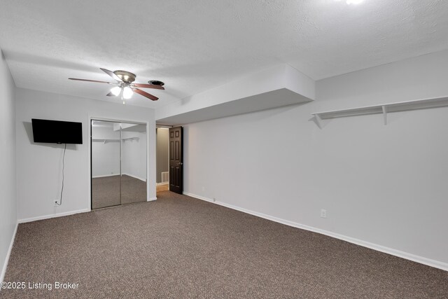 1468 Lakeshore Pkwy, Brandenburg, KY 40108 - unfurnished bedroom with a textured ceiling, carpet flooring, ceiling fan, and a closet