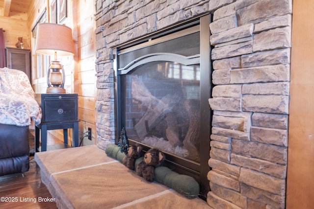 details featuring wood finished floors and wood walls