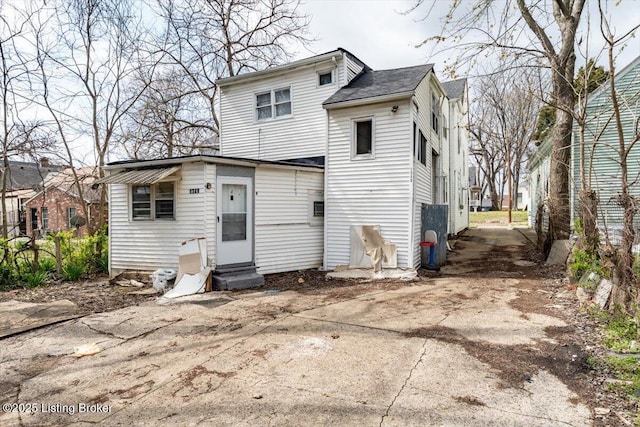 back of house featuring entry steps