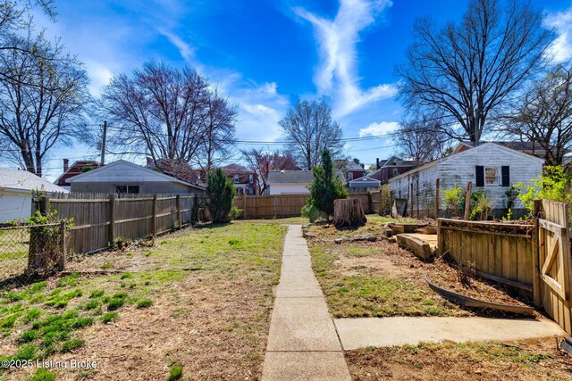 view of yard with a fenced backyard