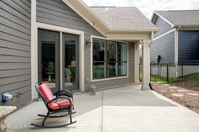 view of patio featuring fence
