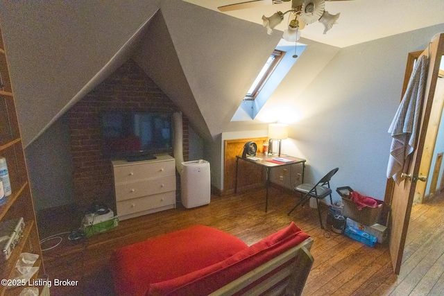 bedroom featuring wood-type flooring, lofted ceiling, and ceiling fan