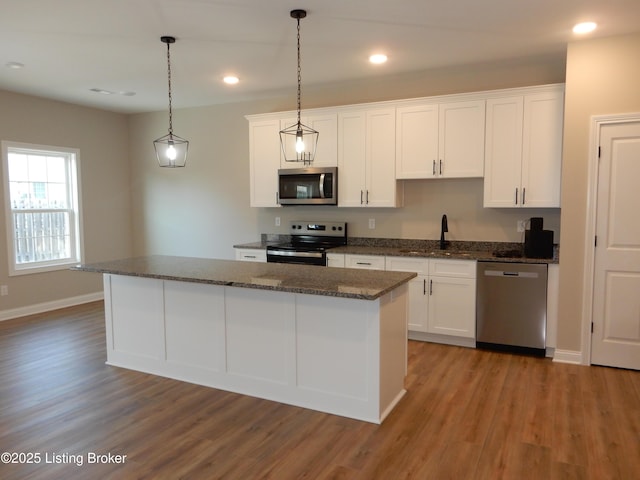 239 Bullitt Creek Dr Unit 12, Shepherdsville, KY 40165 - kitchen with white cabinetry, appliances with stainless steel finishes, and wood finished floors