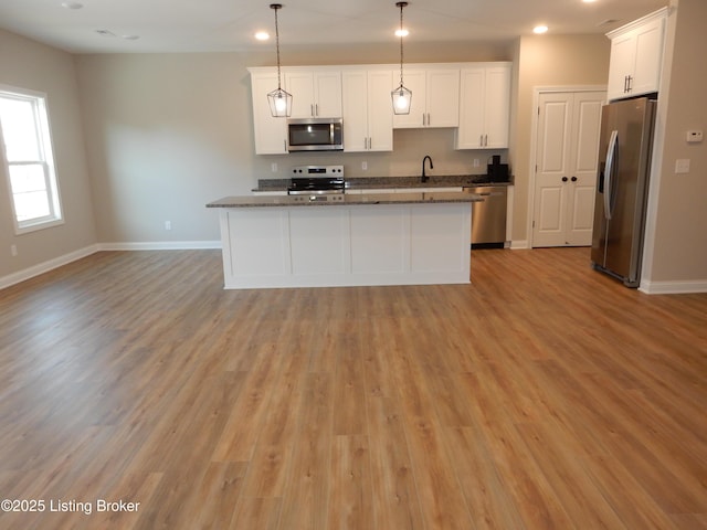 239 Bullitt Creek Dr Unit 12, Shepherdsville, KY 40165 - kitchen featuring white cabinets, light wood-style floors, appliances with stainless steel finishes, and baseboards