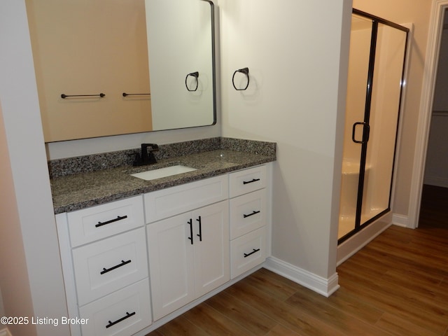 239 Bullitt Creek Dr Unit 12, Shepherdsville, KY 40165 - full bathroom with a stall shower, baseboards, wood finished floors, and vanity