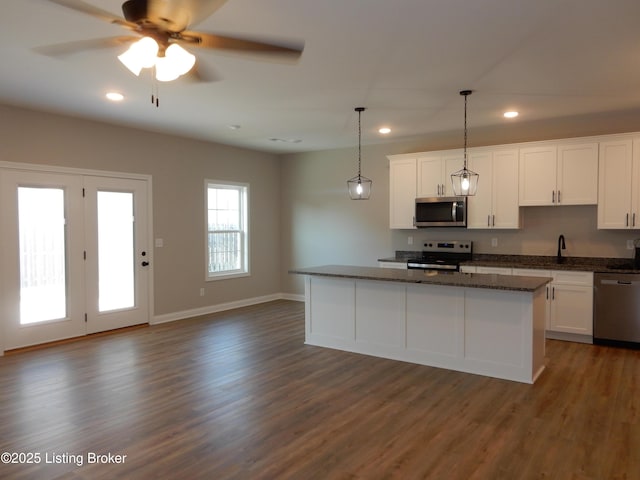 239 Bullitt Creek Dr Unit 12, Shepherdsville, KY 40165 - kitchen featuring recessed lighting, dark wood-style flooring, a center island, white cabinets, and appliances with stainless steel finishes