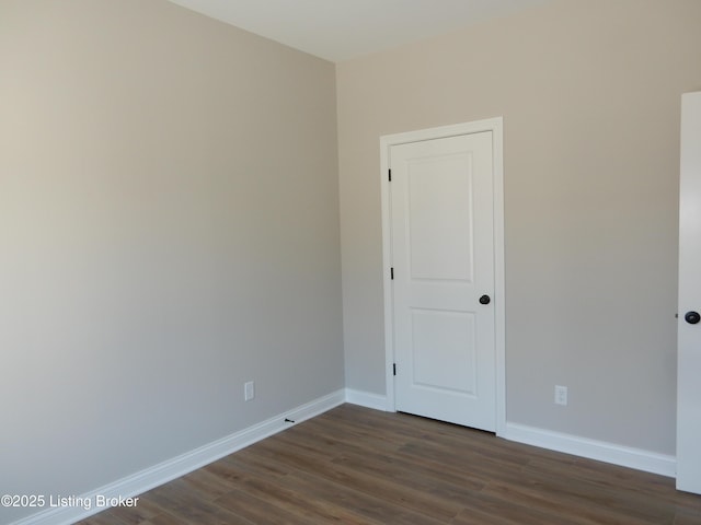 239 Bullitt Creek Dr Unit 12, Shepherdsville, KY 40165 - unfurnished room featuring baseboards and dark wood-type flooring