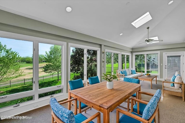 sunroom with a skylight, carpet floors, lofted ceiling, a ceiling fan, and recessed lighting