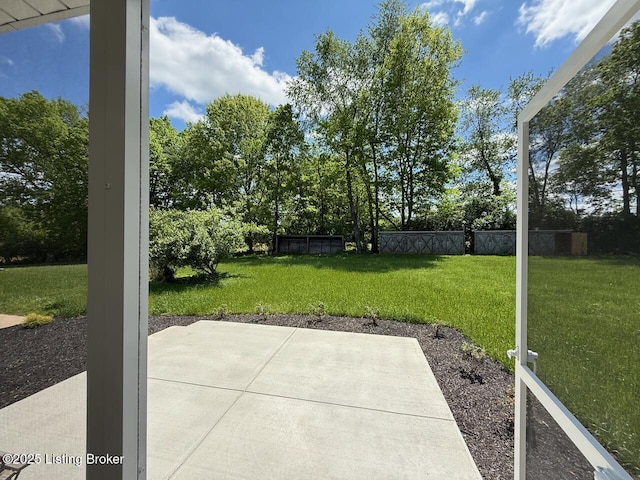 view of patio with view of wooded area