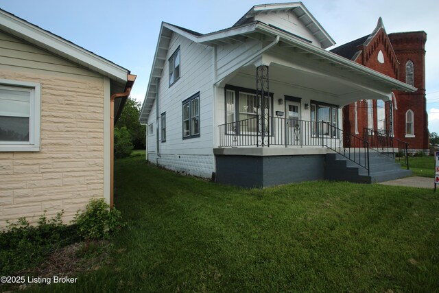 4832 N Main, Eminence, KY 40019 - view of front facade featuring a porch and a front yard