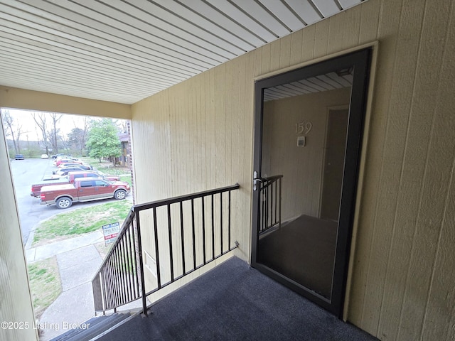 view of exterior entry with a carport