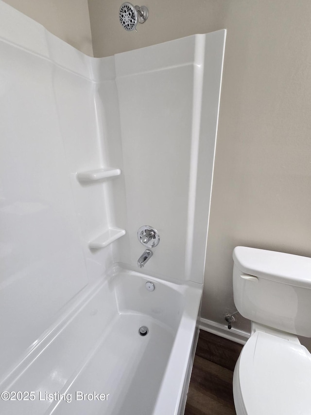 bathroom featuring toilet and wood finished floors