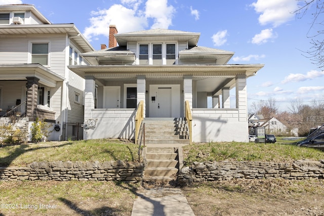 view of front of property with covered porch, stairway, and a chimney