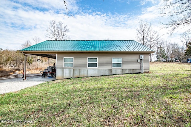 1400 Bewleyville Rosetta Rd, Irvington, KY 40146 - view of side of home featuring an attached carport, metal roof, and a lawn